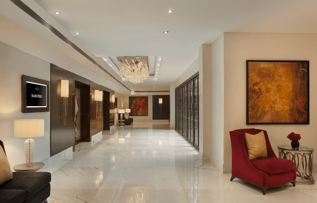 Luxury hotel lobby with a red chair.