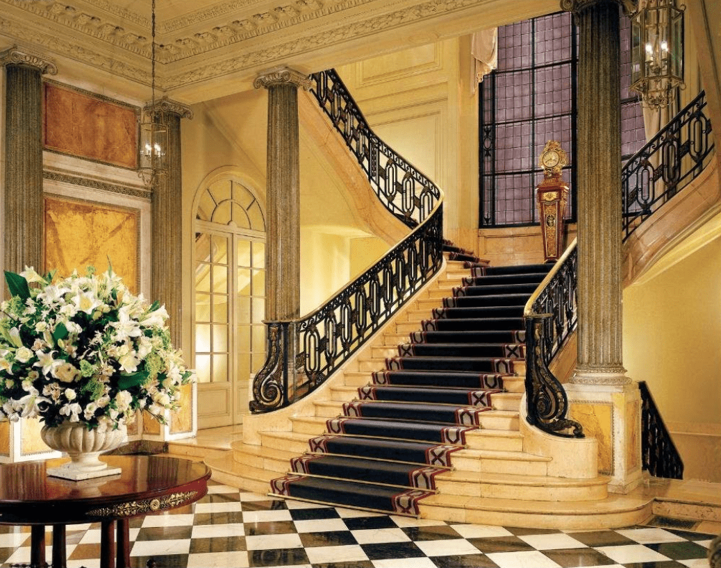 Ornate staircase in a grand building.