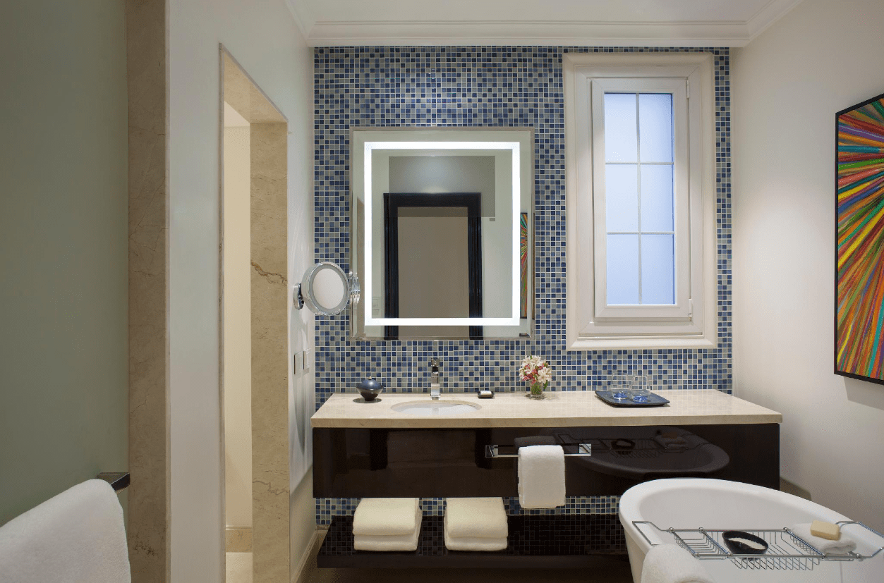 Modern bathroom with vanity and bathtub.