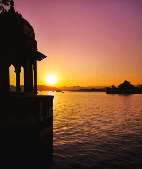 Silhouette of a building at sunset.