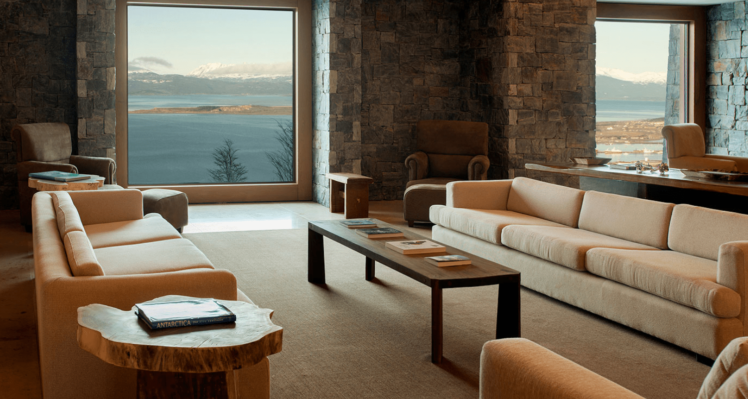 Living room with view of mountains and water.