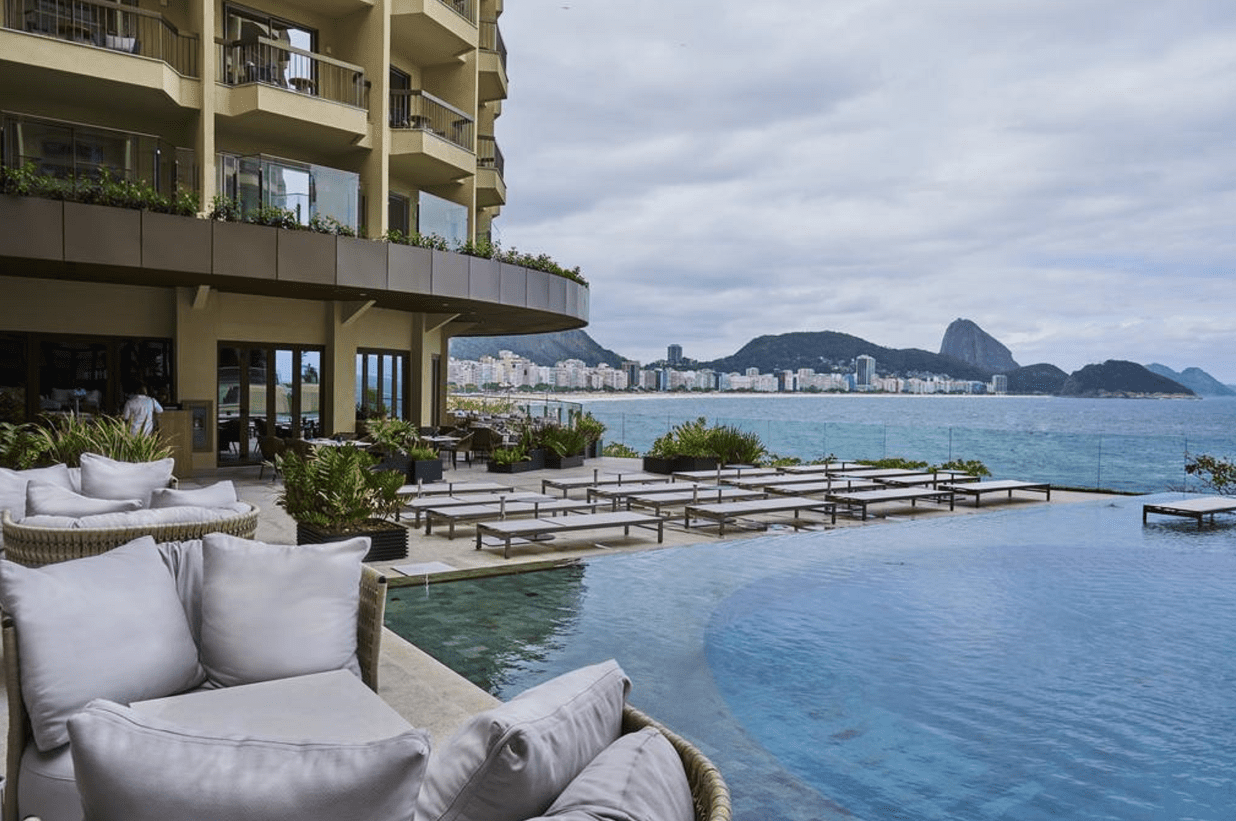 Luxury hotel pool with ocean view.