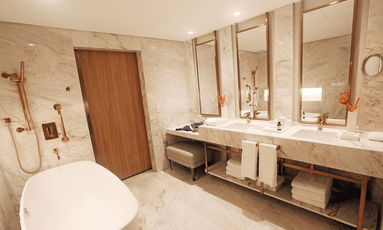 Luxury bathroom with marble and gold accents.