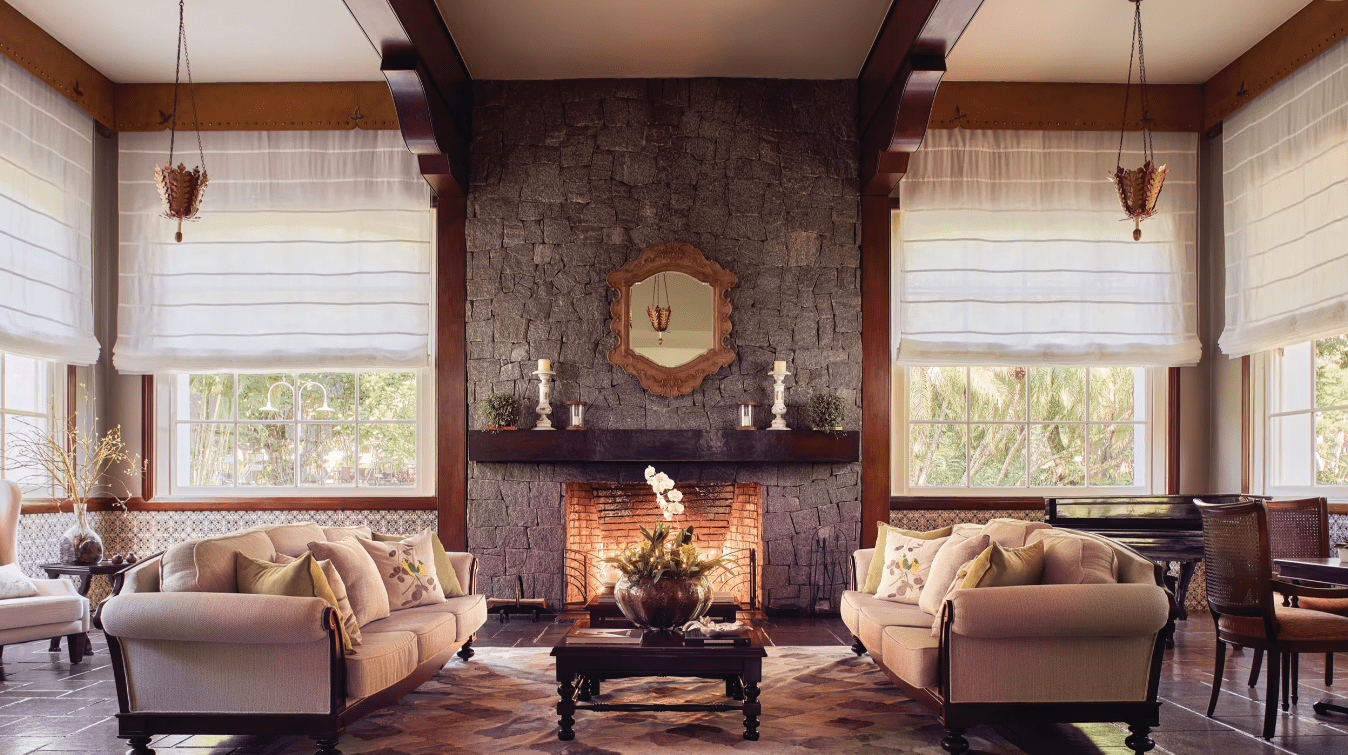 Stone fireplace with two couches in a living room.