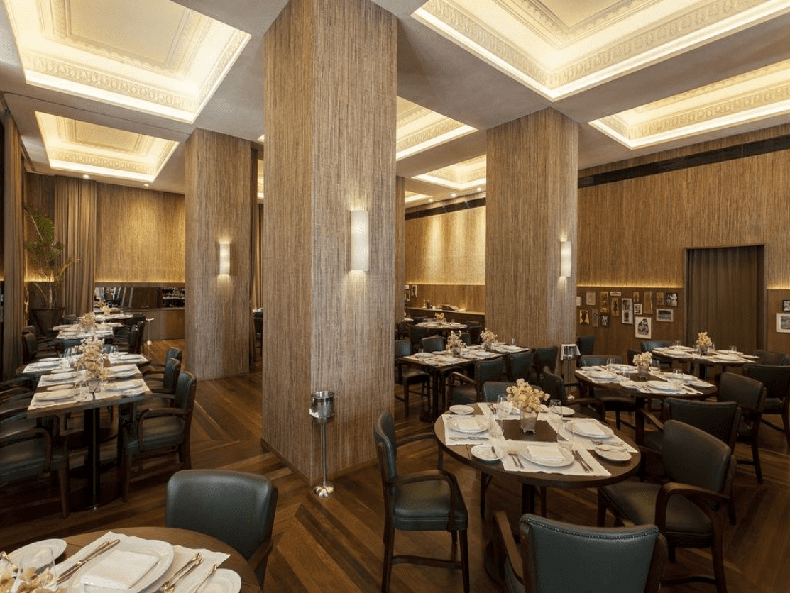 Modern restaurant interior with wooden walls.