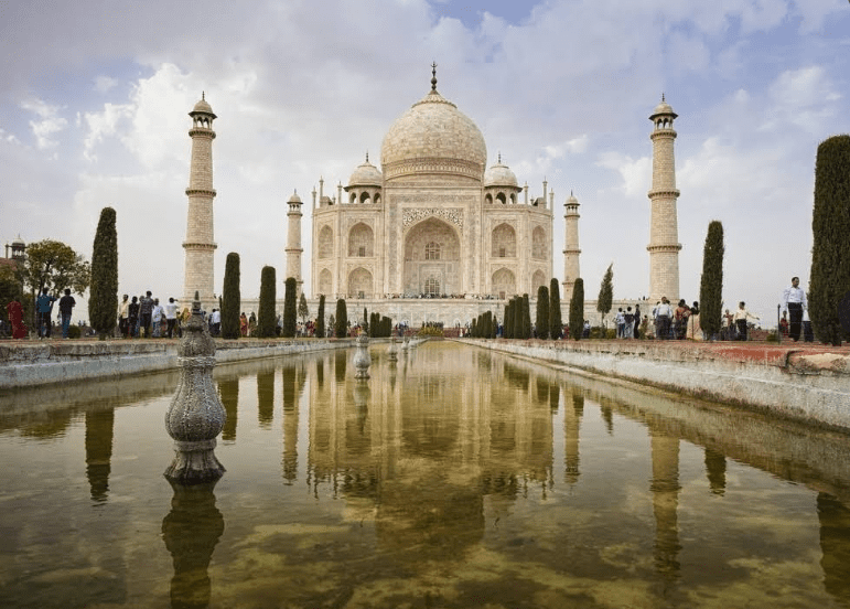 The Taj Mahal reflected in a pond.