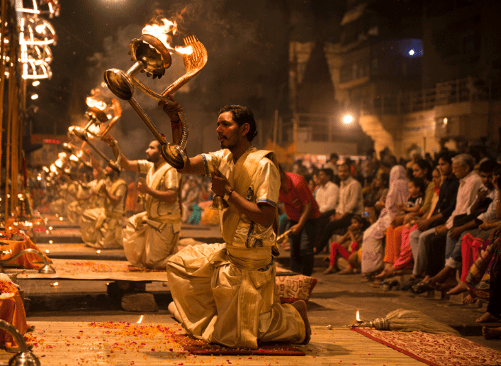 Indian men perform a religious ceremony.