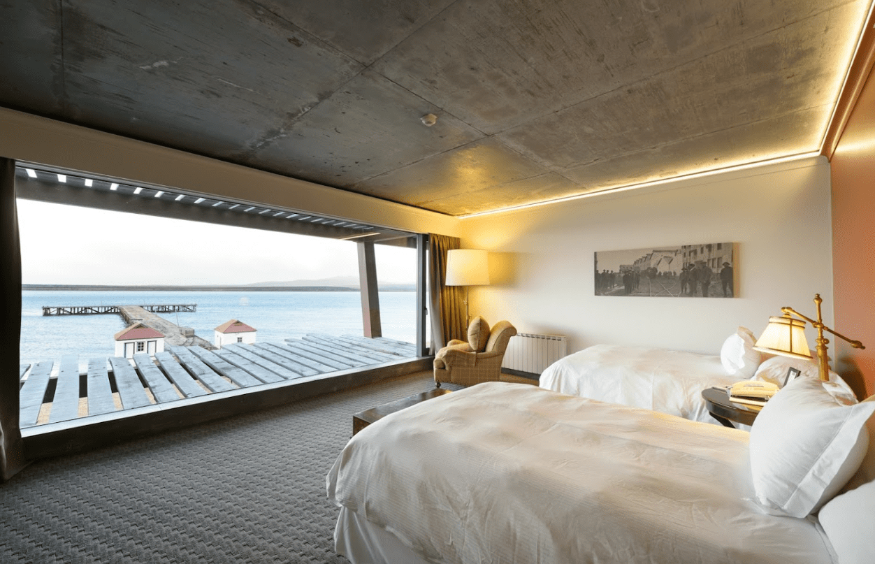 Hotel room with two beds and ocean view.