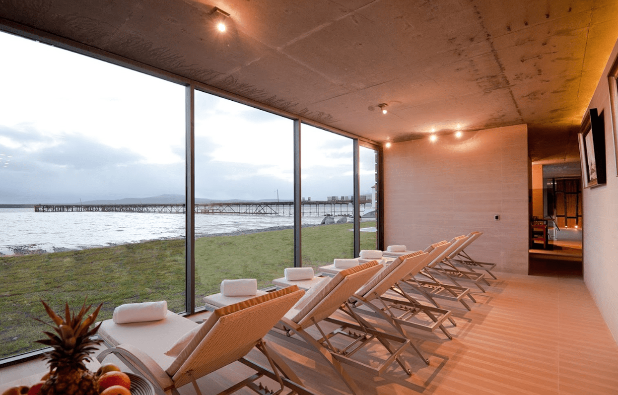 Lounge chairs overlooking waterfront pier.