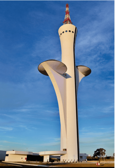 Tall white tower with curved supports.