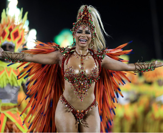 Woman in red and gold carnival costume.