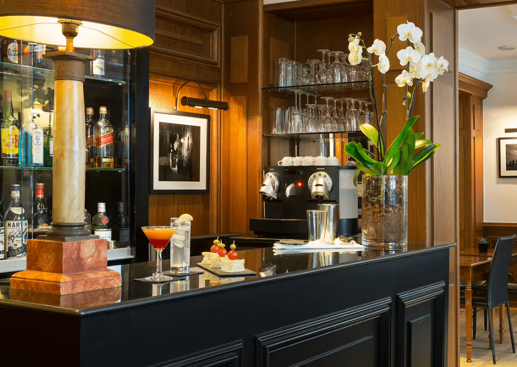 Bar counter with cocktails and orchids.