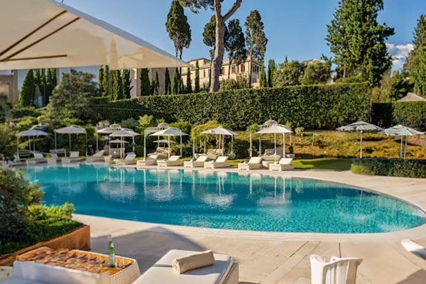 Luxury resort pool with lounge chairs.