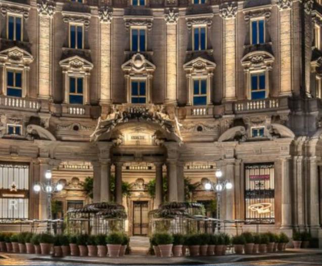 Ornate building with ornate entrance and plants.