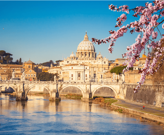 St. Peter's Basilica with a bridge and flowers.