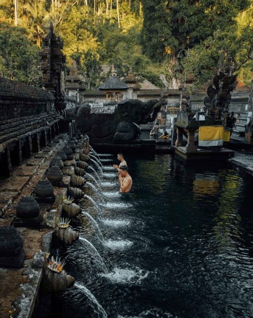 Sacred water flowing in a temple pool.