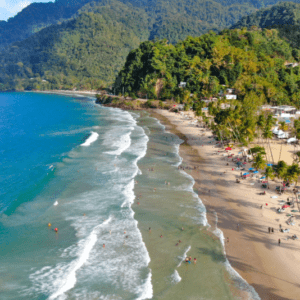 An aerial view of a beach with a lot of people on it.