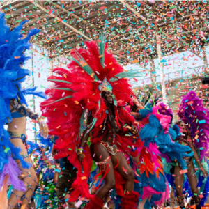 Carnival dancers with colorful feathers and confetti.