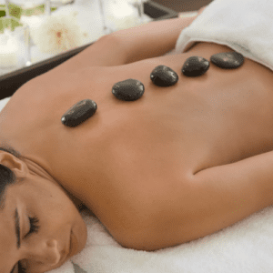 A woman getting a back massage at a spa.