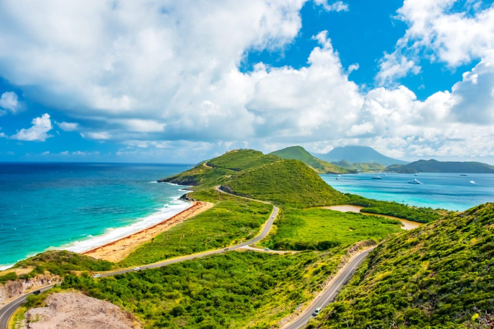 Scenic coastal road with turquoise water.