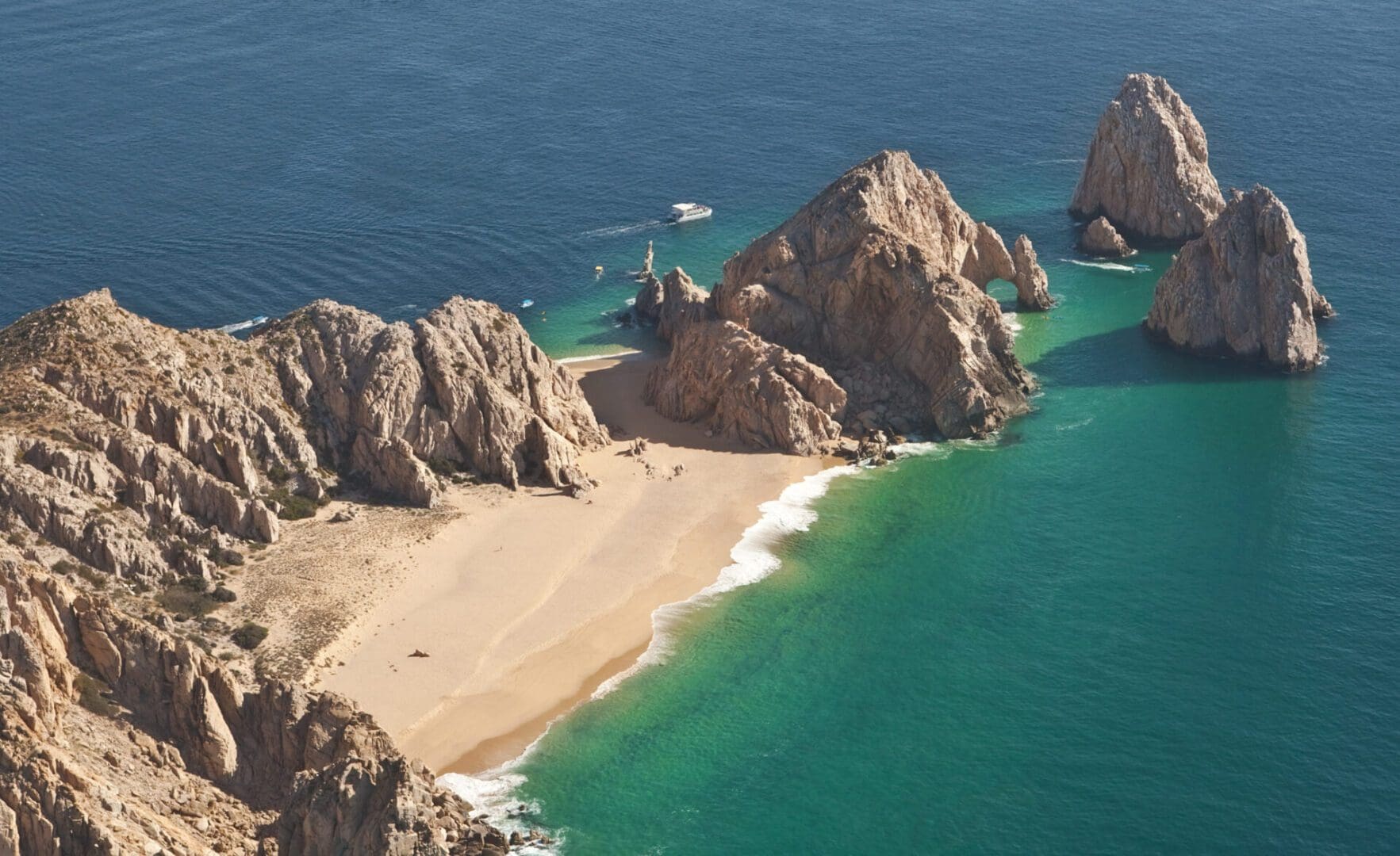 Aerial view of rocky beach and ocean.