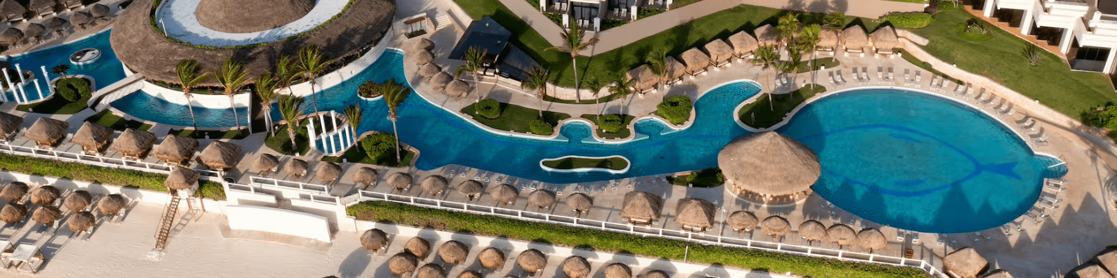 Aerial view of a resort pool and beach.