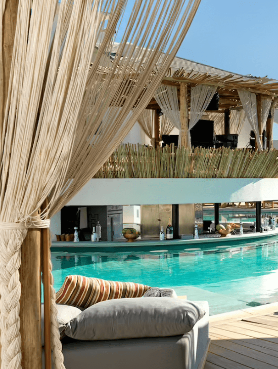 Poolside lounge chairs with a view.