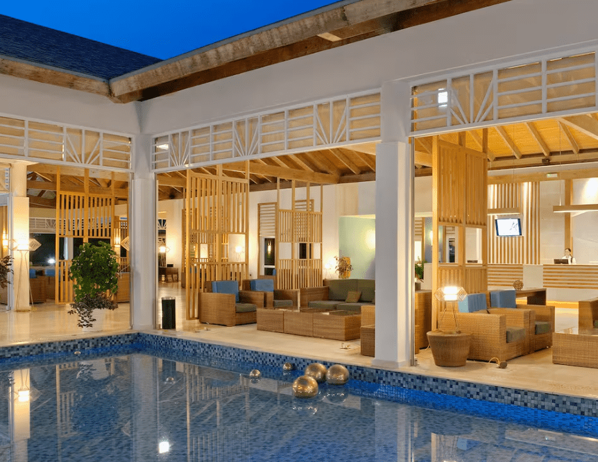 Poolside lounge area with wooden accents.