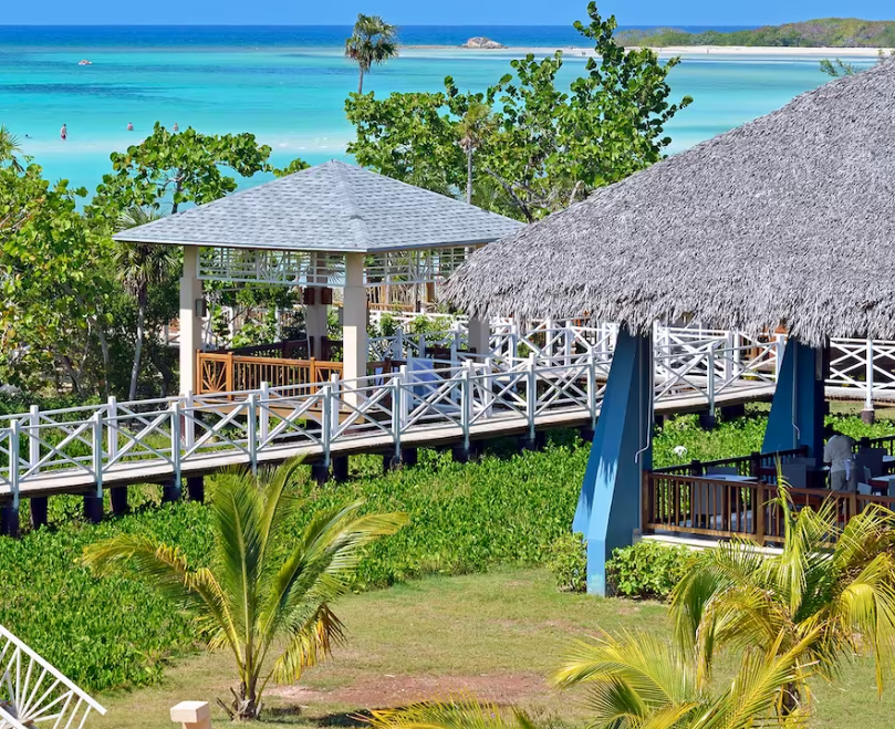 Gazebo and wooden walkway overlooking beach.