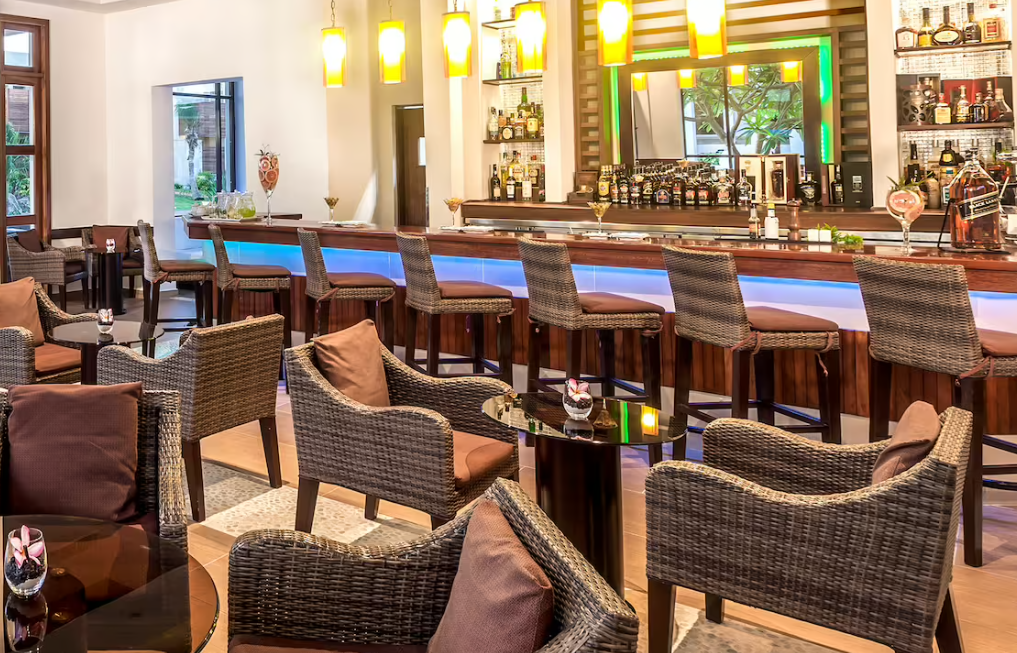 Rattan chairs and bar stools in a lounge.