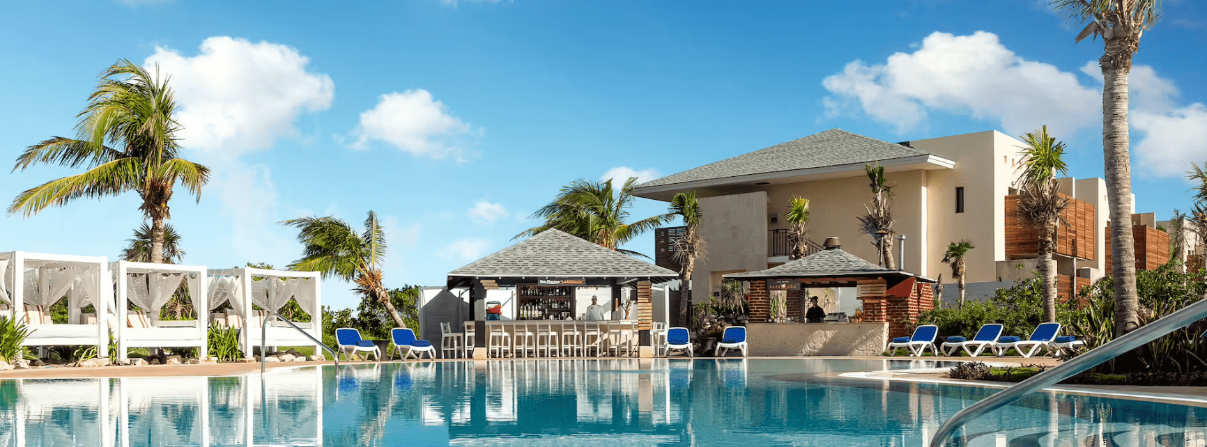 Resort pool with bar and cabanas.