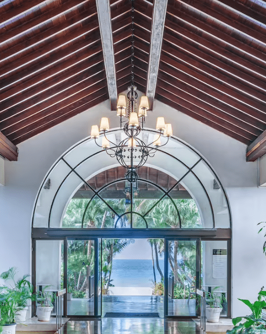 Ocean view through an arched doorway.