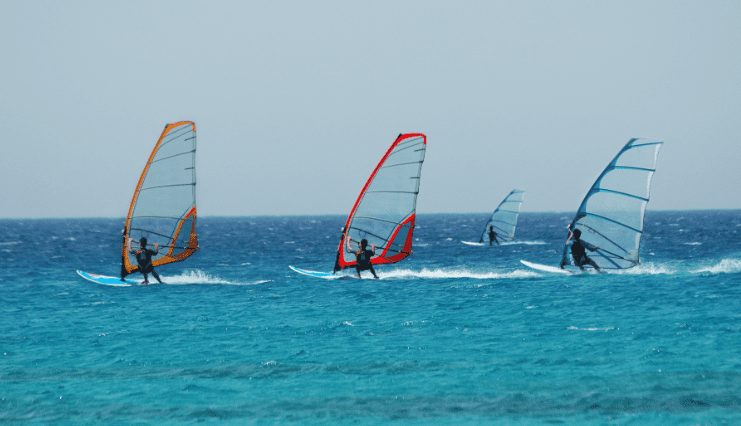 Windsurfers on the ocean waves.