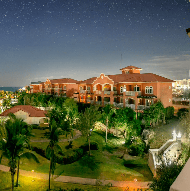 Night view of resort with starry sky.