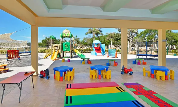 Colorful playground with tables and chairs.