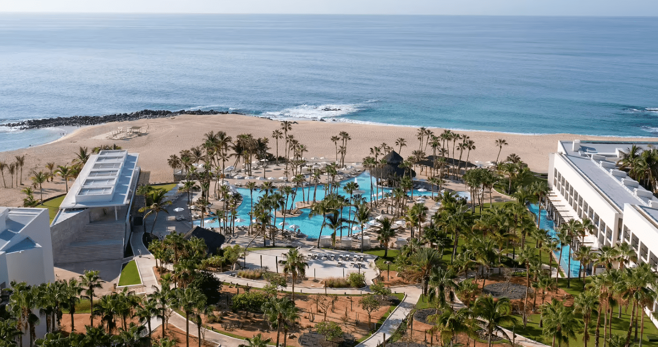 Aerial view of a resort with a pool.