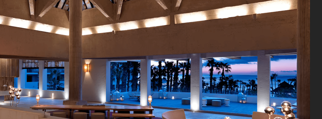 Modern hotel lobby with ocean view.