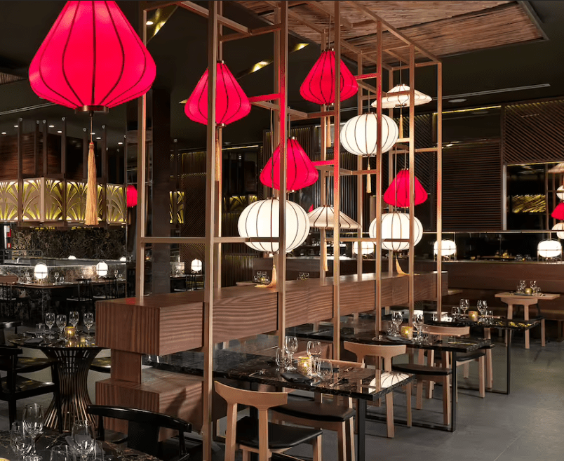 Modern restaurant with red and white lanterns.