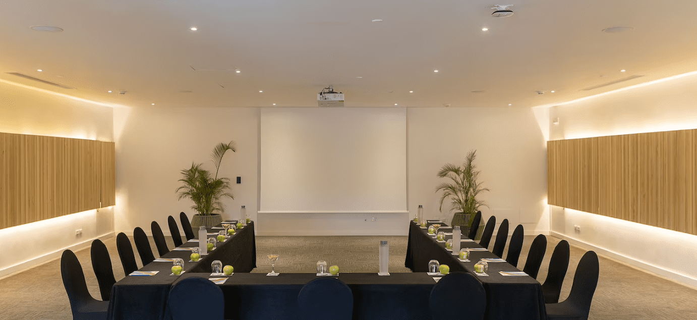 Modern conference room with black chairs.