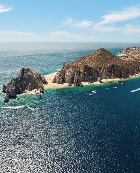 Aerial view of a rocky island in the ocean.