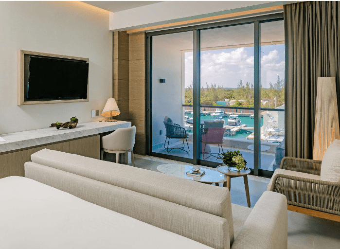 Modern hotel room with marina view.