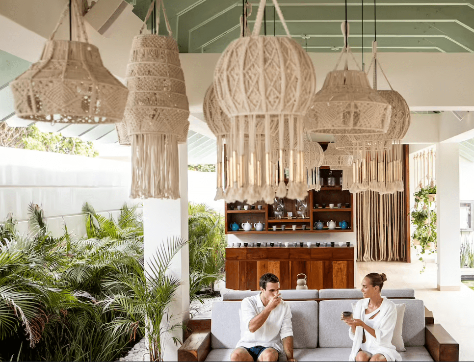 Couple relaxing in a tropical lounge.