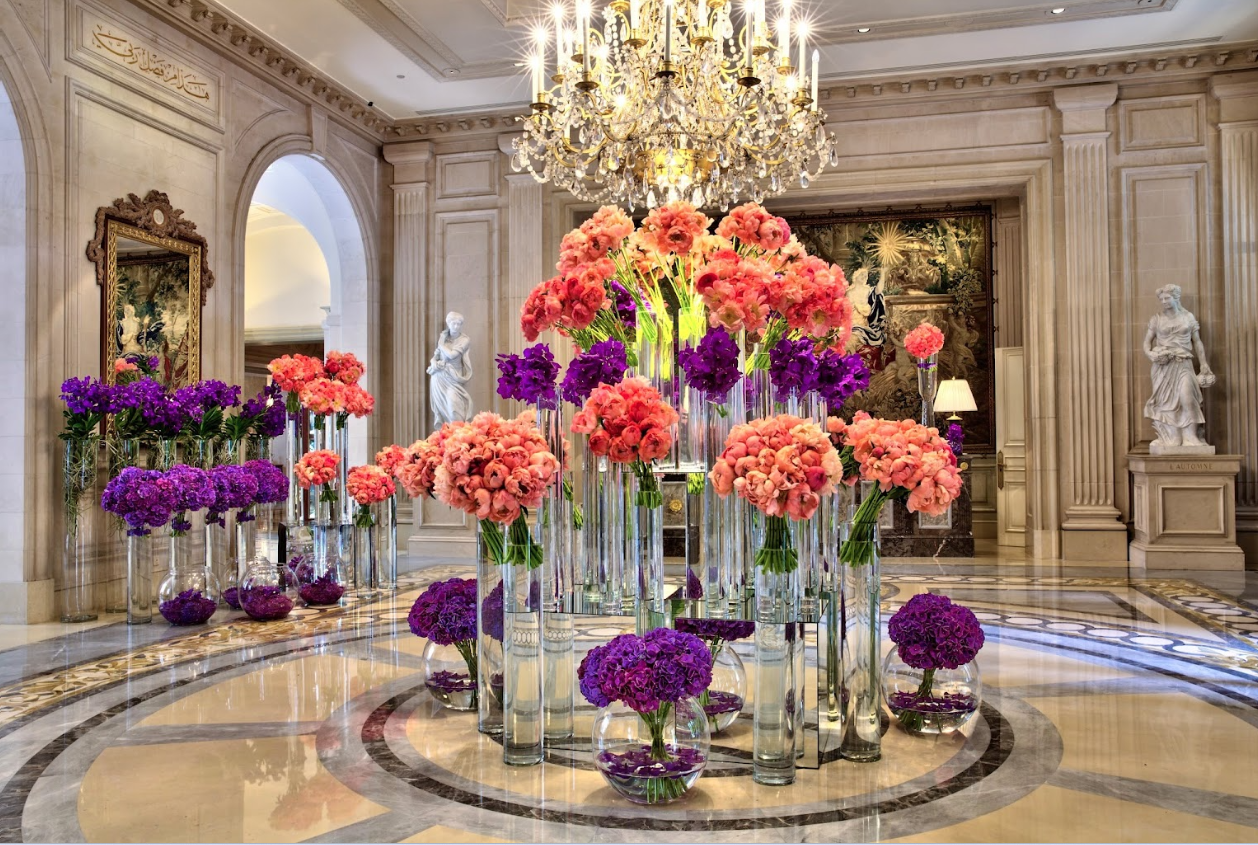 Hotel lobby with colorful flower arrangement.