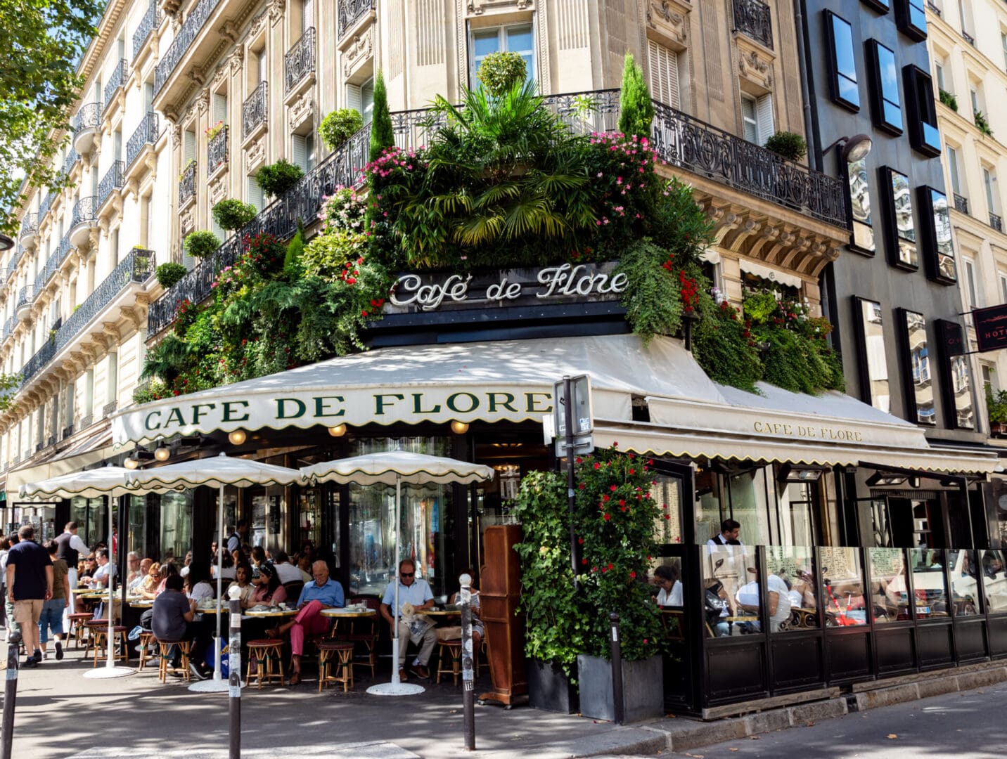 Paris sidewalk cafe with outdoor seating.