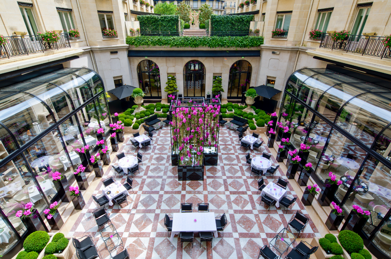 Courtyard with tables and chairs in a Parisian restaurant.