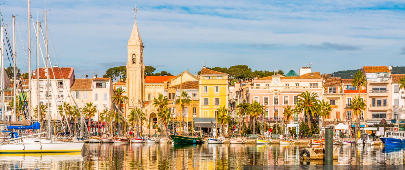 Colorful buildings and boats in a harbor.