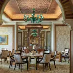 Elegant dining room with ornate chandelier.