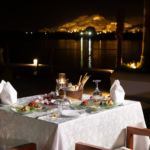 Romantic dinner table by the water.