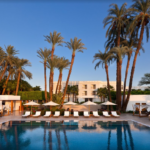 Palm trees surround a resort pool.