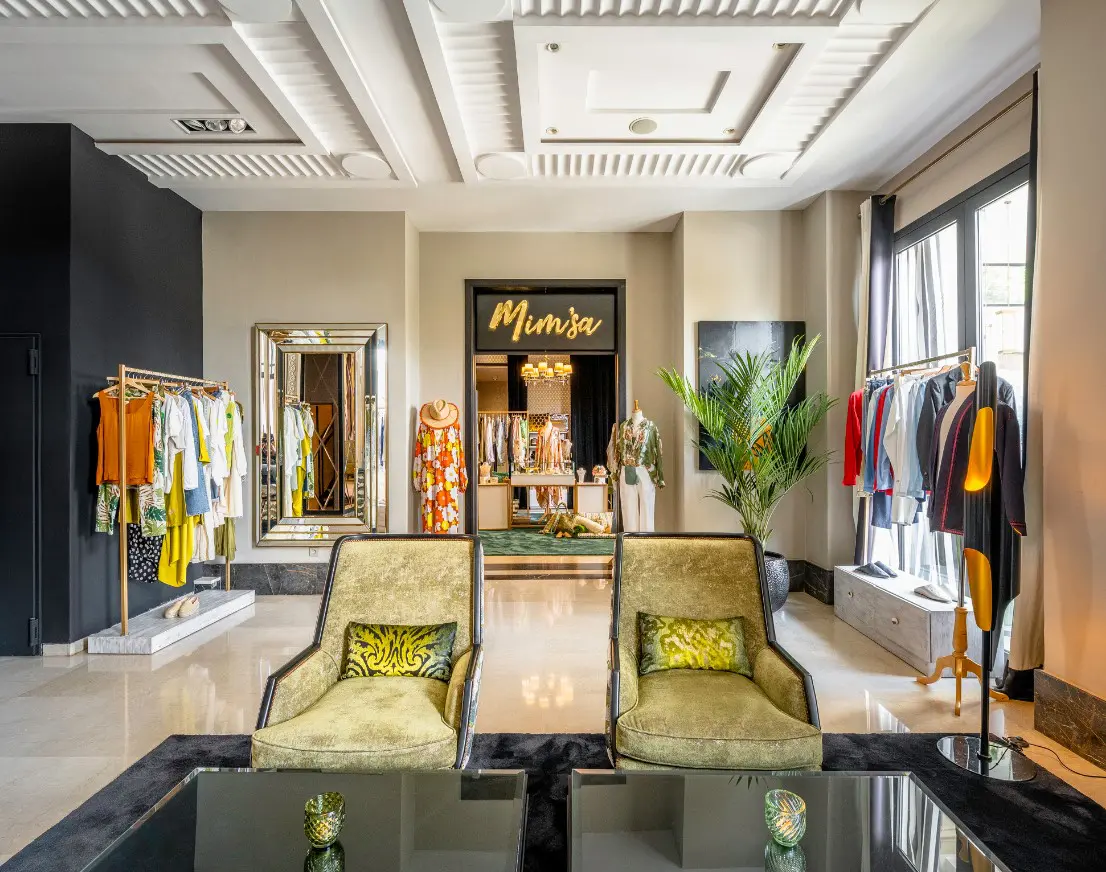 Boutique store interior with green chairs.